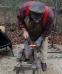 Tim forging a stake