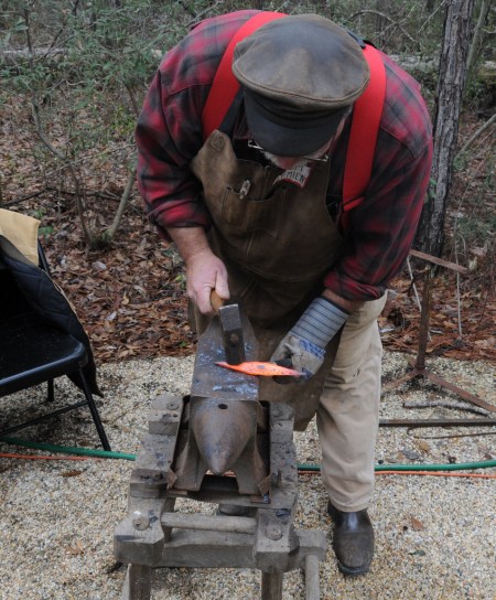 Tim forging a stake