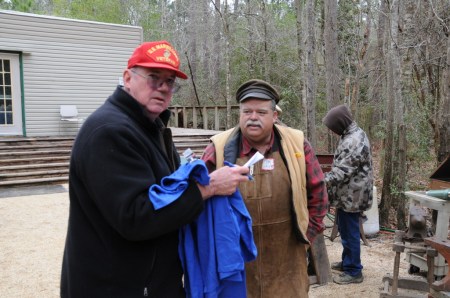 Sid hands out "T" shirts