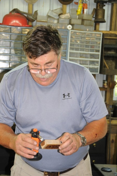 Heating wet wood to anchor the silver