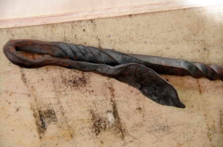 Leaf handle on a fire poker