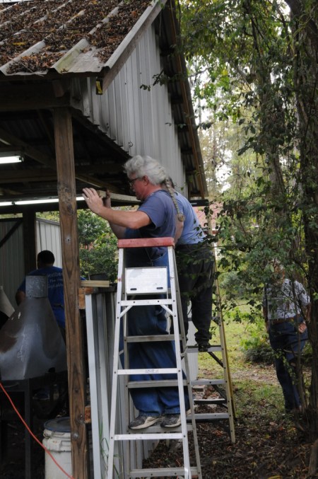 Larry works on back windows