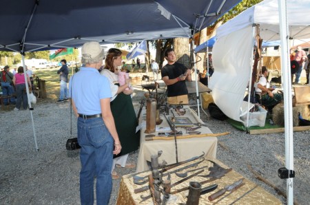 Tom's daughter, Laramie, 'mans' his display table