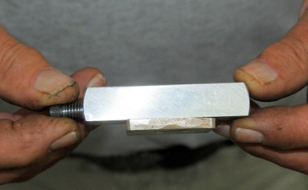 Silver guard held by jig